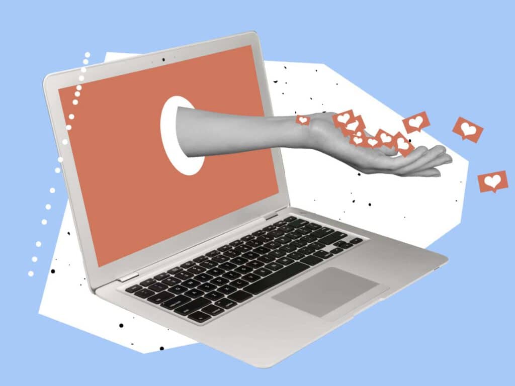 Hand reaching out from laptop screen with hearts, symbolizing digital supporter engagement.